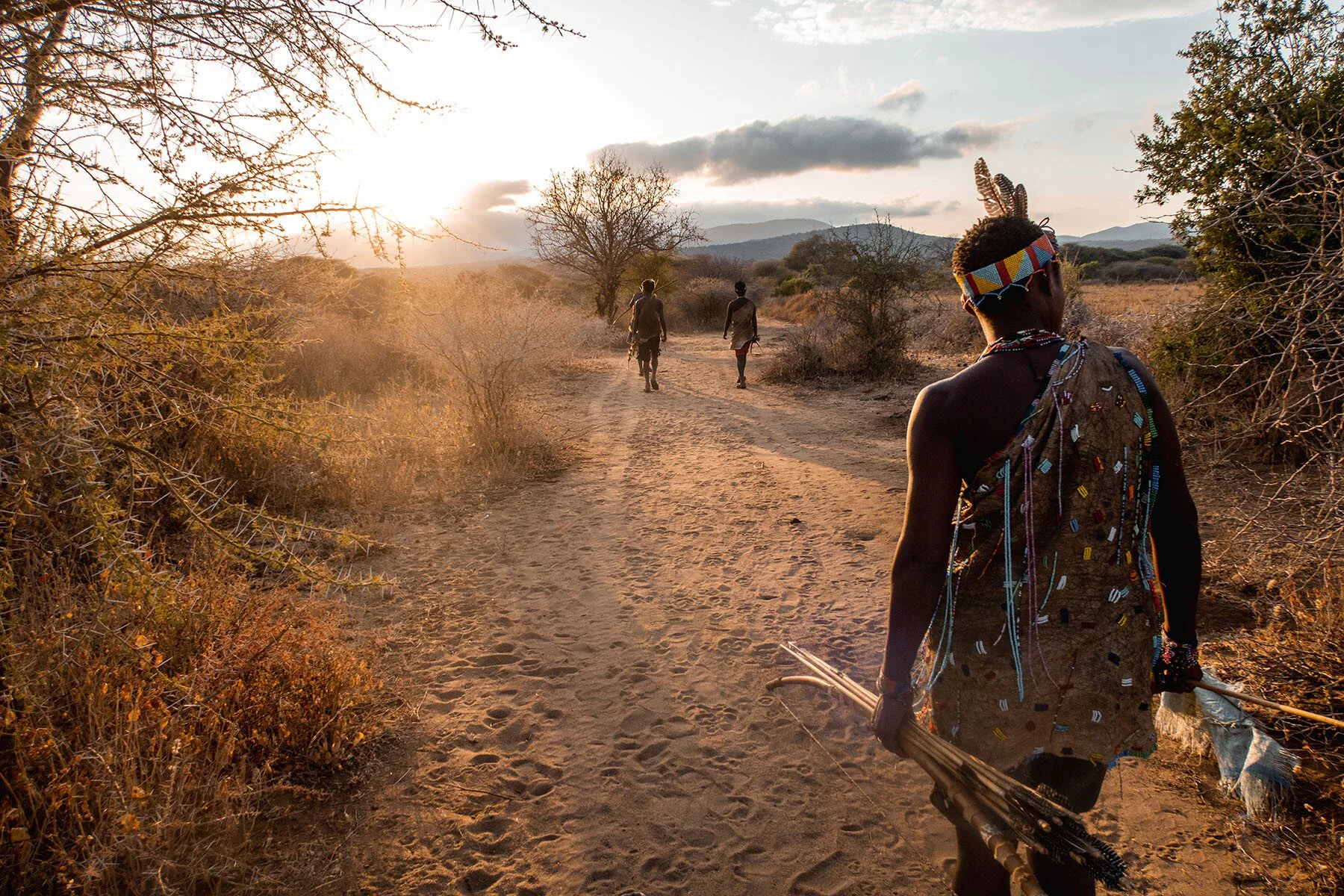 Hadzabe hunter with traditional bow and arrow