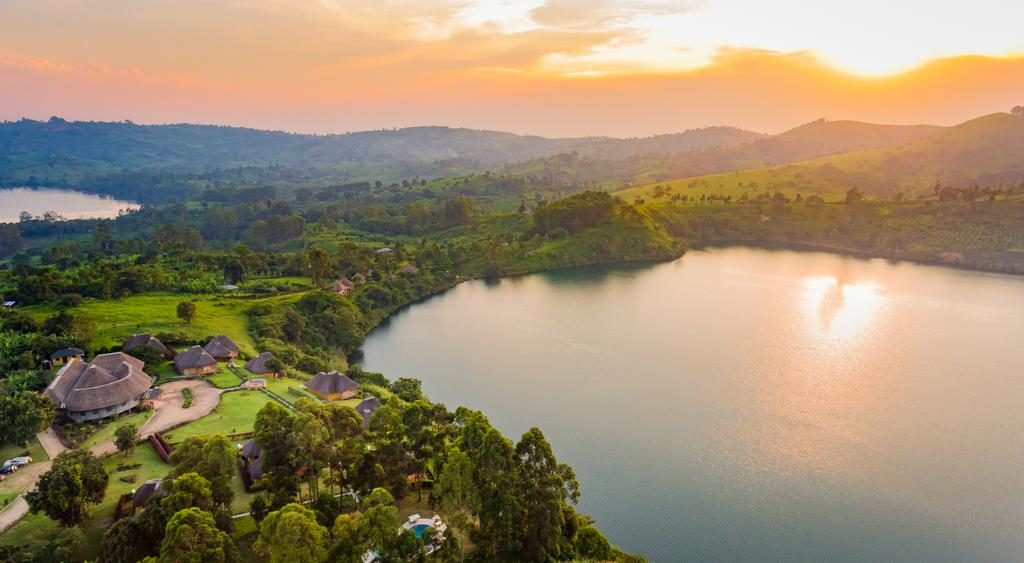 Deep green volcanic crater lakes bordering the outskirts of Kibale Forest