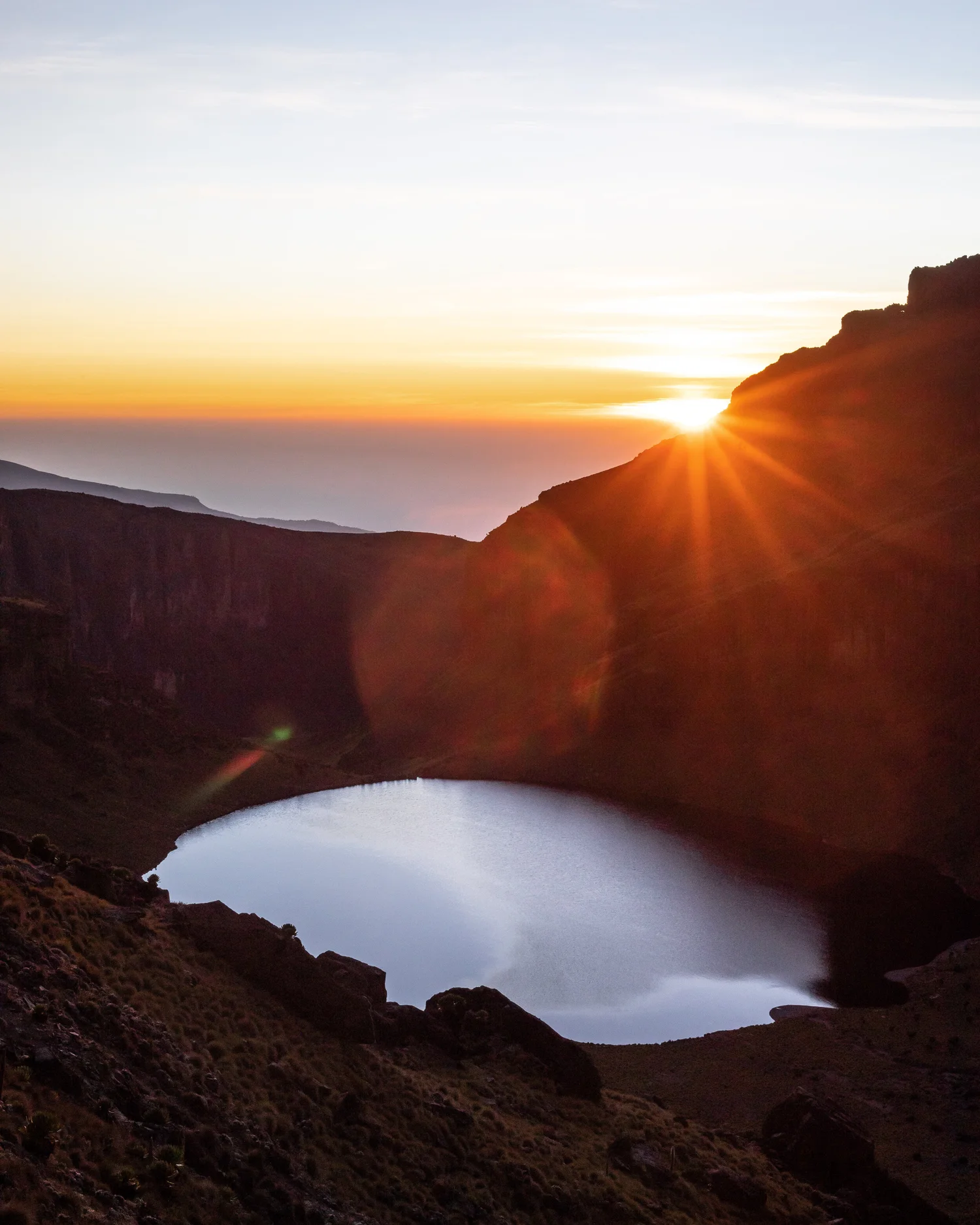 The pristine sapphire waters of glacial Lake Michaelson tucked into a sheer canyon floor